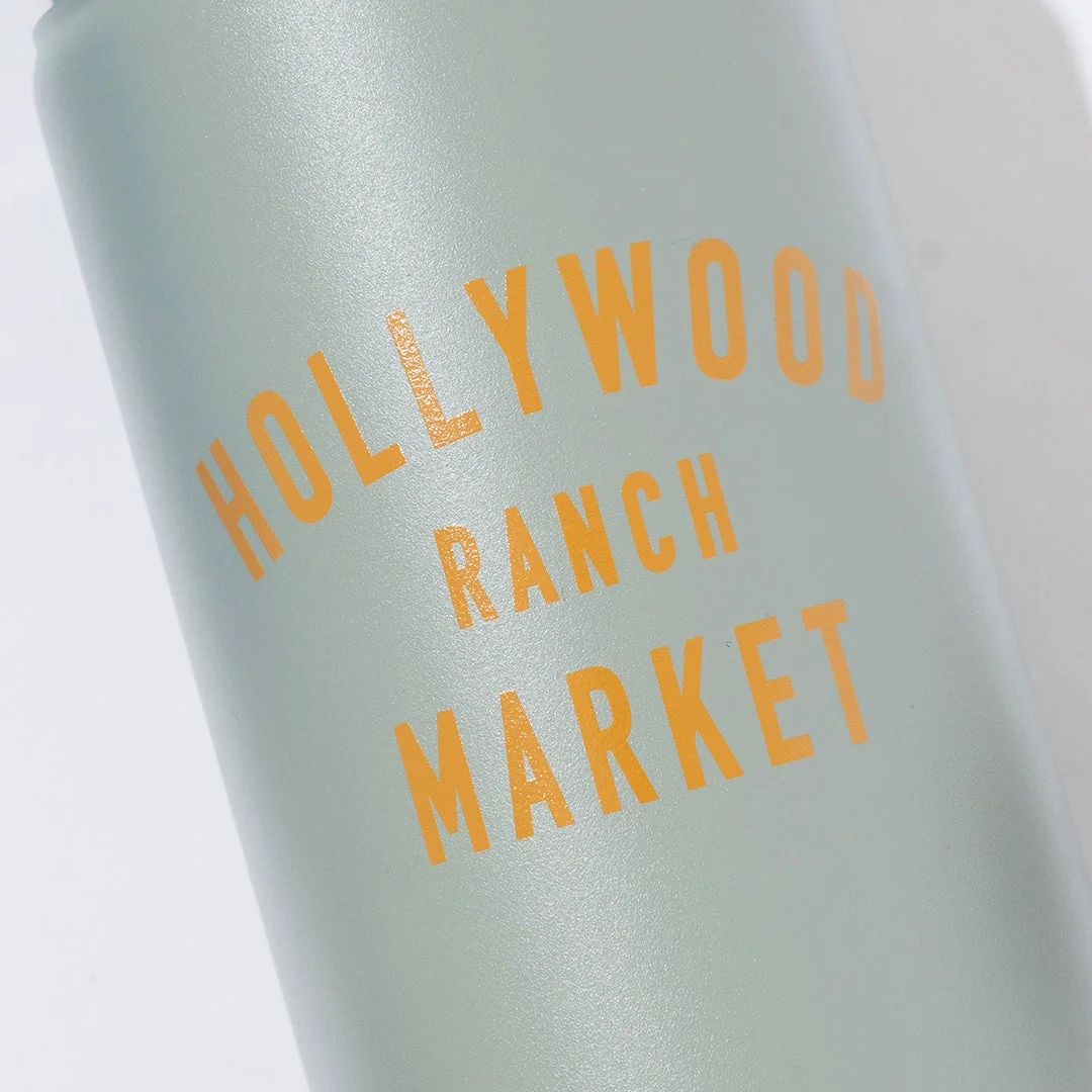 「HOLLYWOOD RANCH MARKET」のロゴがオレンジ色で印字された、明るい緑色のボトルまたは容器のクローズアップ画像です。